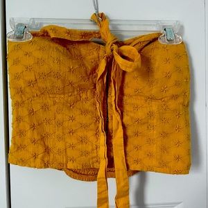 Yellow halter cropped top.